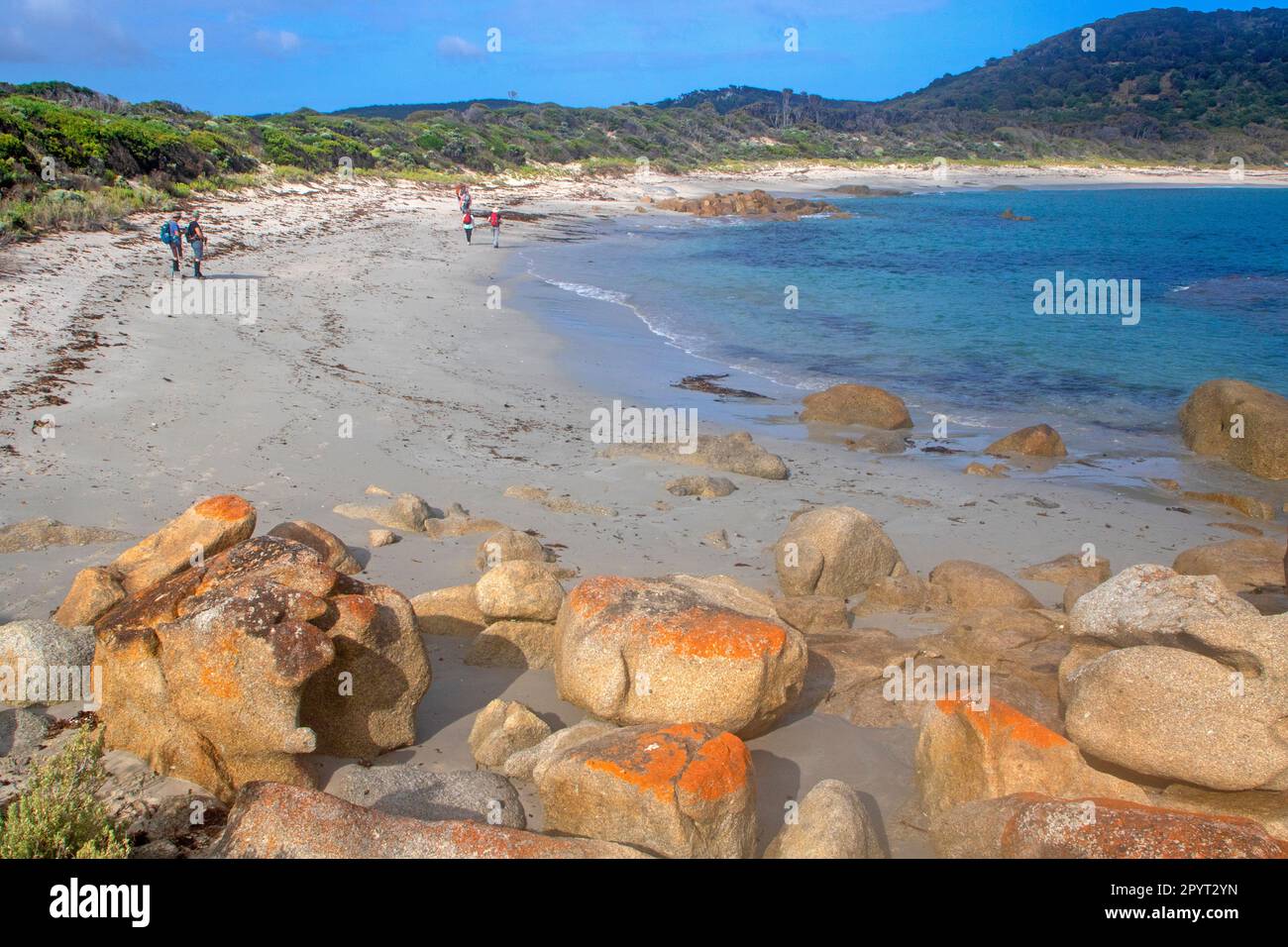 Walkers on a beach near Stanley Point, the northern tip of Flinders