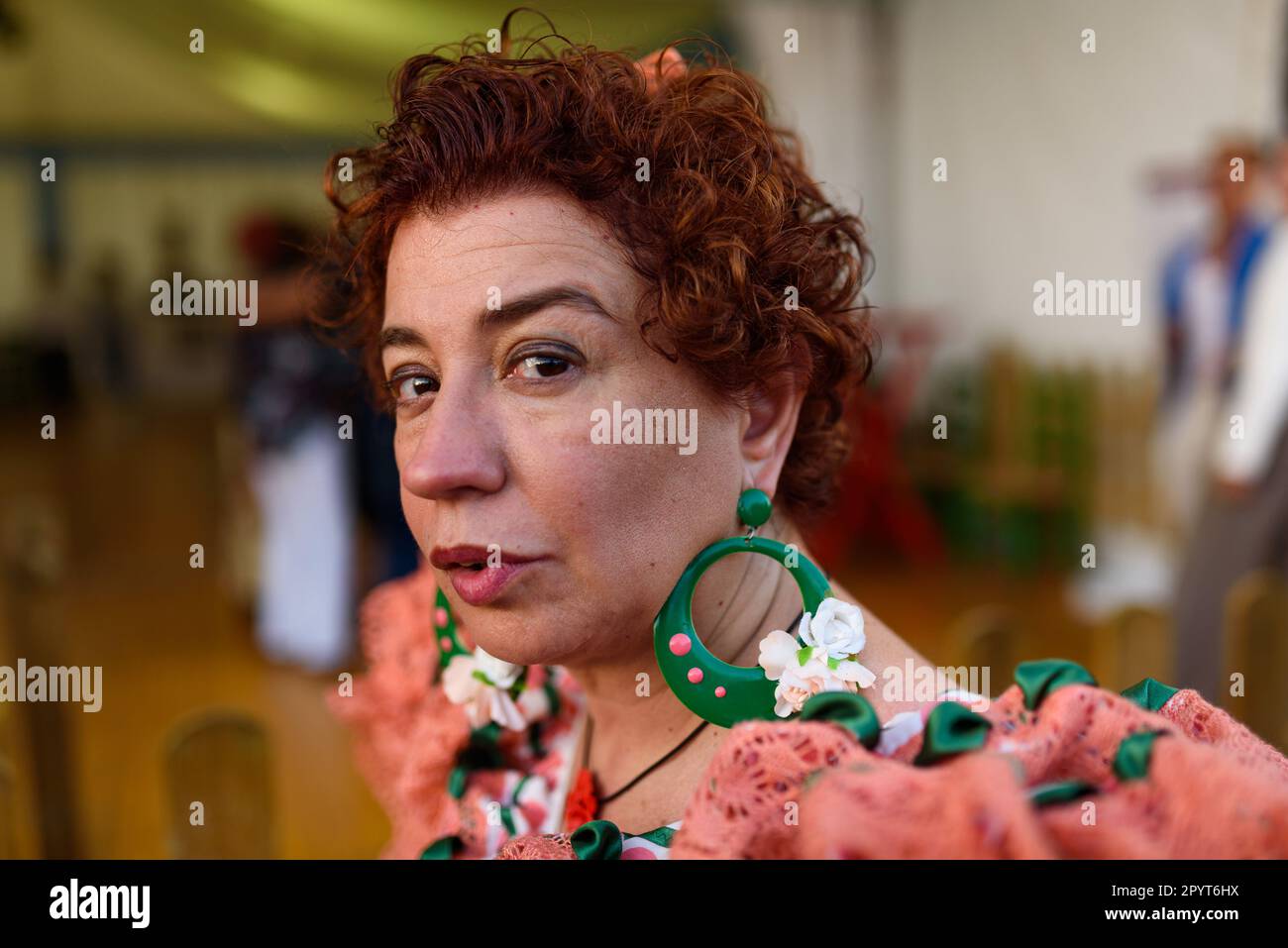 In this close up portrait a woman in traditional andalusian dress is seen during celebrations for the 'Feria de Abril' fair in the Forum Park. The fai Stock Photo
