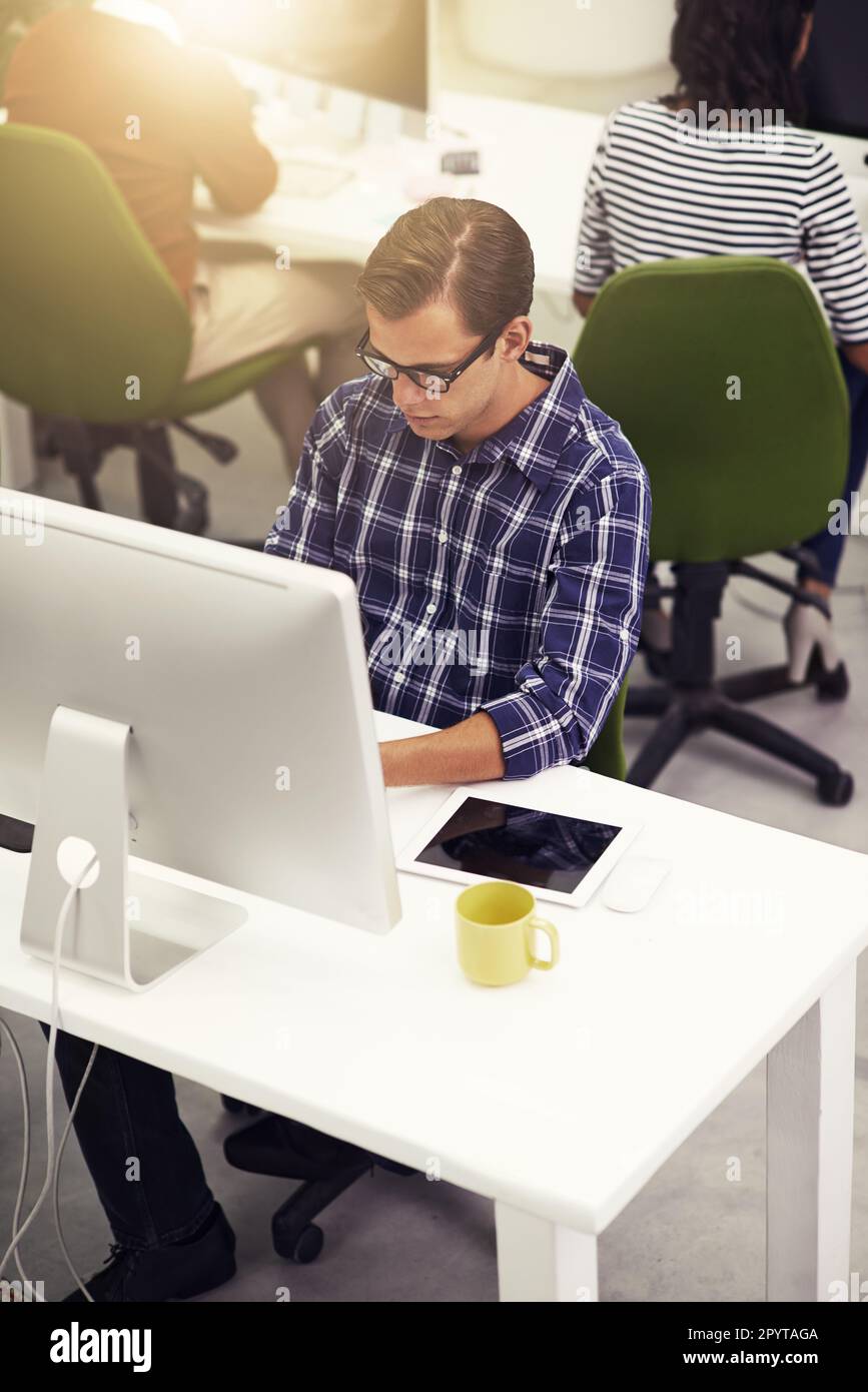 Designer at work. a colleagues at work on computers in an office. Stock Photo