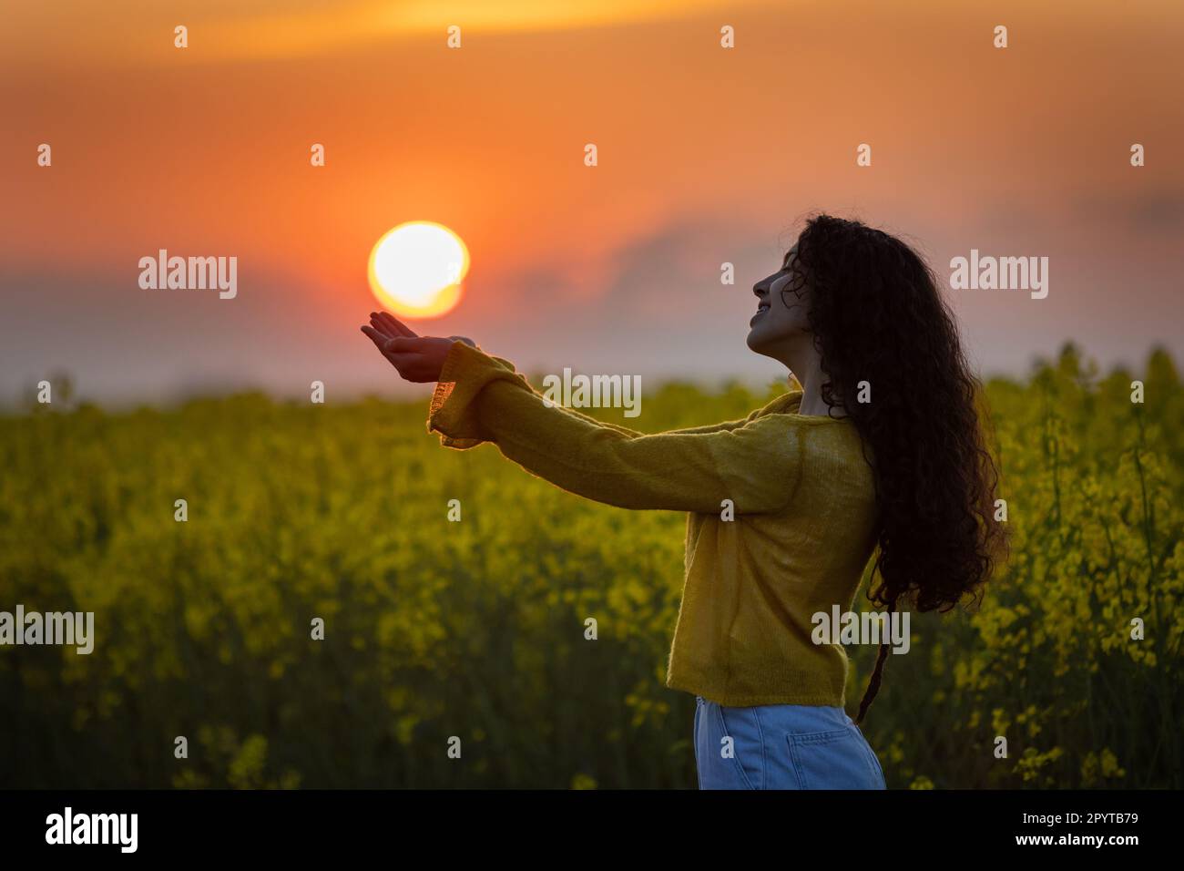 Holding sun in hands hi-res stock photography and images - Alamy