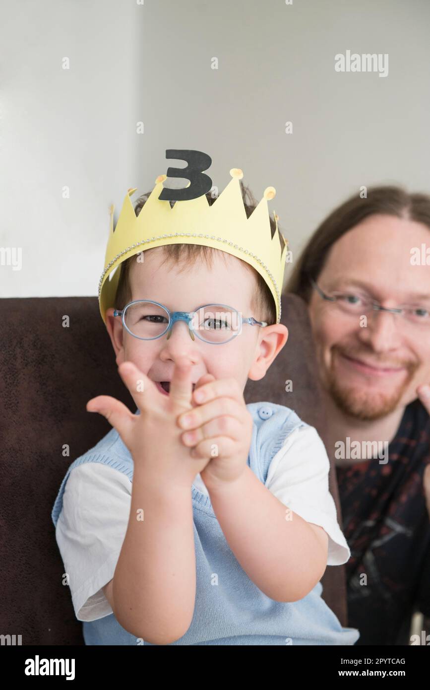 Portrait of father and son on birthday, Bavaria, Germany Stock Photo