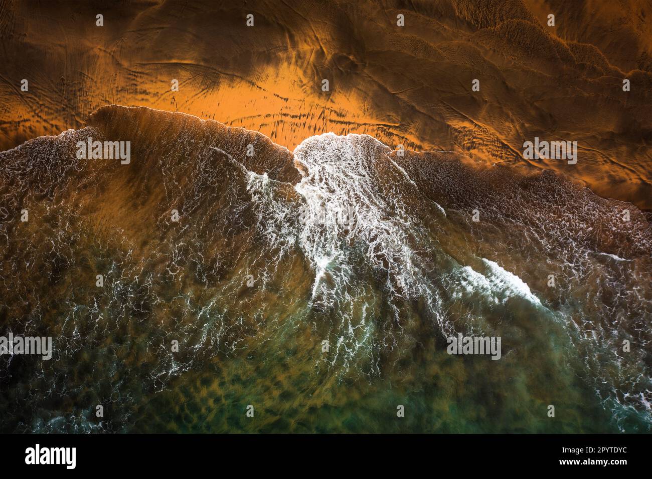 Flying over the waves of the sea at Otur beach. Asturias. Spain. Stock Photo