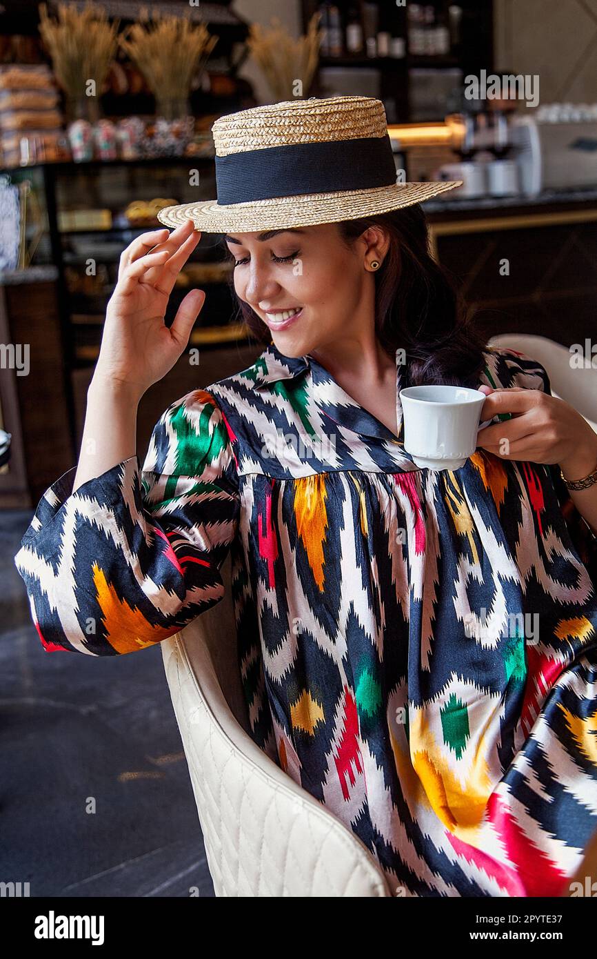 Woman drinking coffee in Tashkent caffee Stock Photo