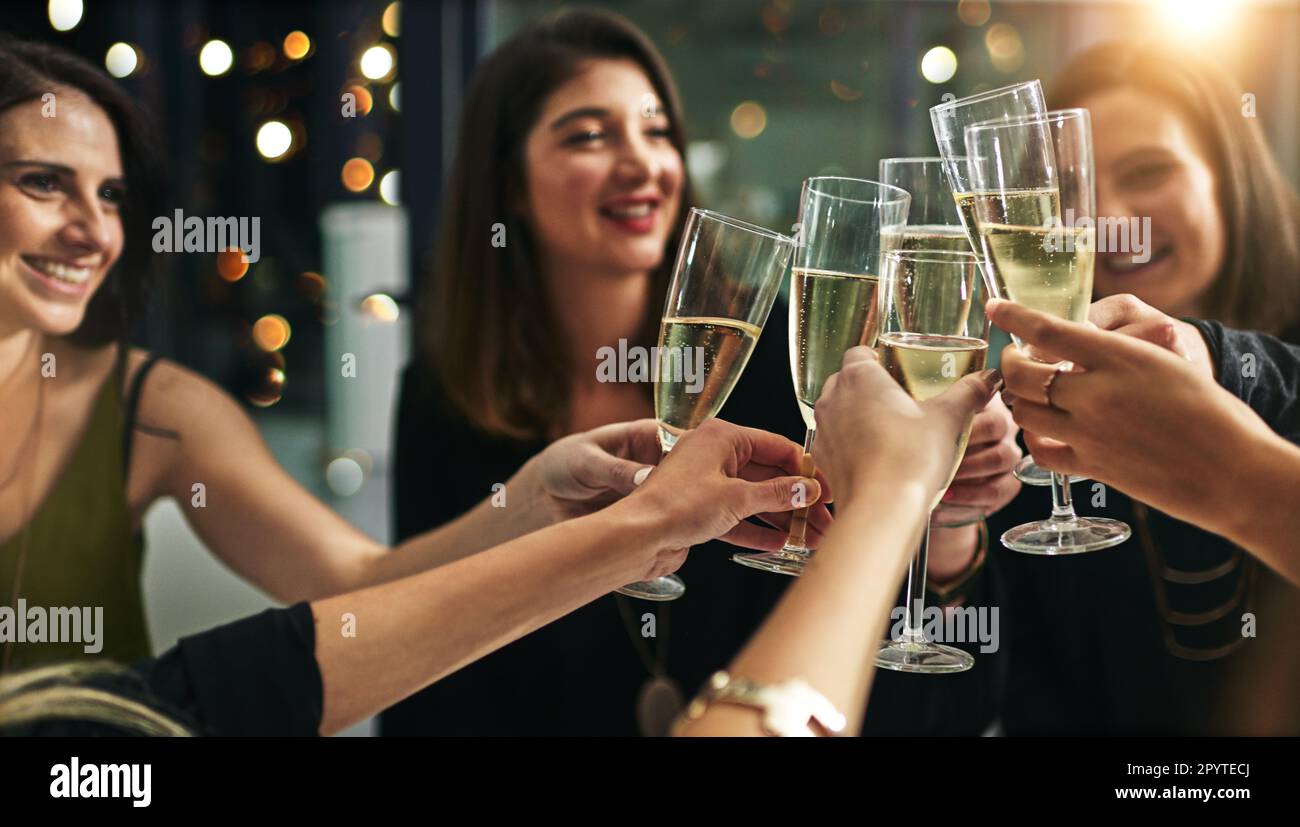Toast, party and champagne with friends at restaurant for celebration