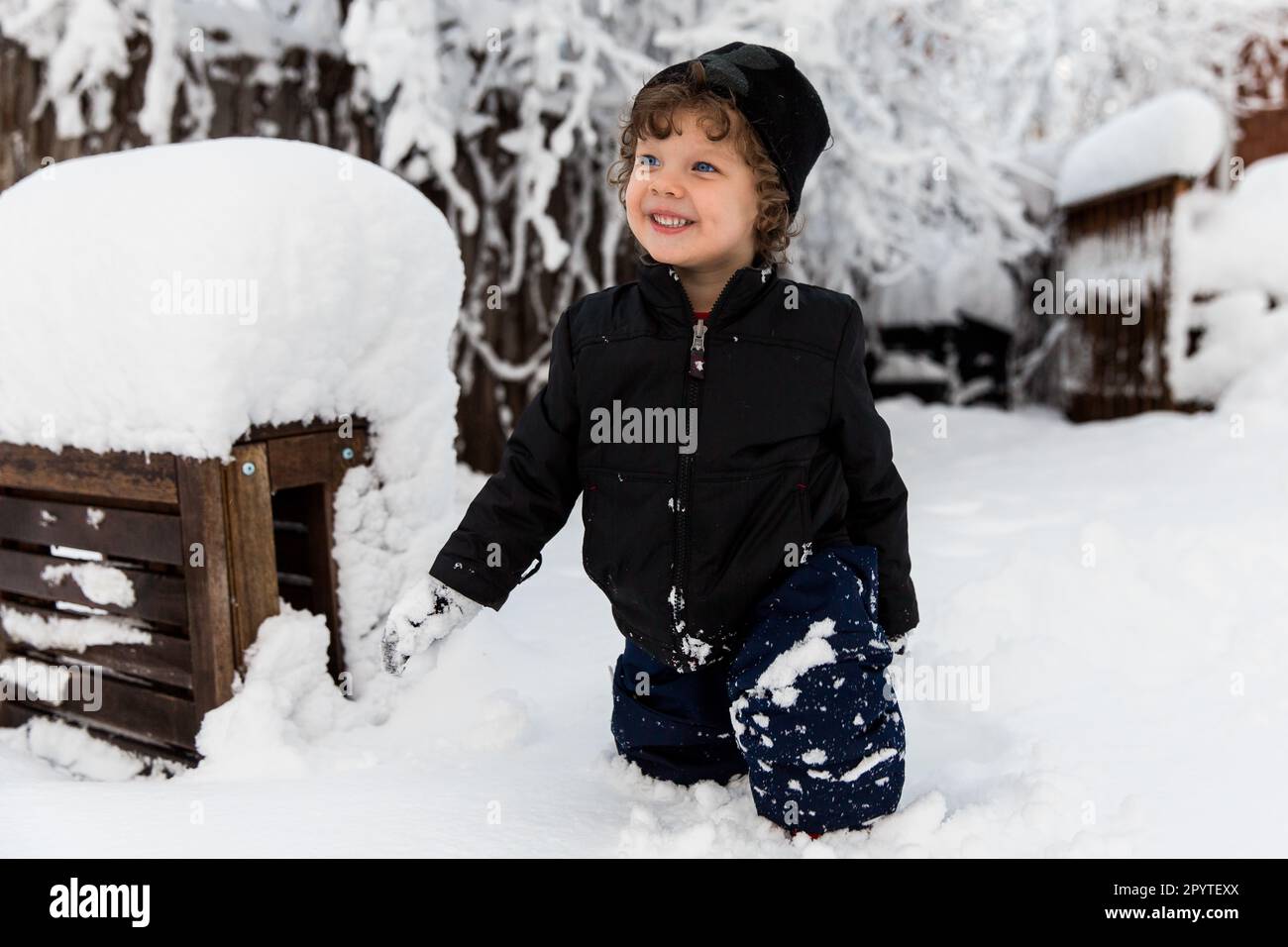 Young child outside on snowy day Stock Photo