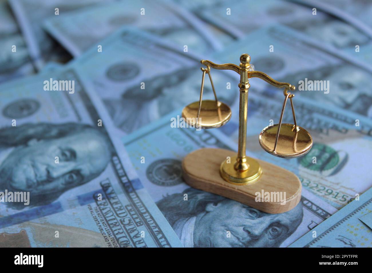 Balancing scale on top of money. Law, bribery, justice and corruption concept Stock Photo