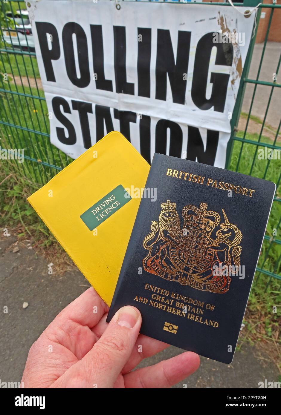 Mandatory recognised photo ID,Driving licence and British Passport,for voting in local council and general elections, Polling Station,Runcorn, England Stock Photo