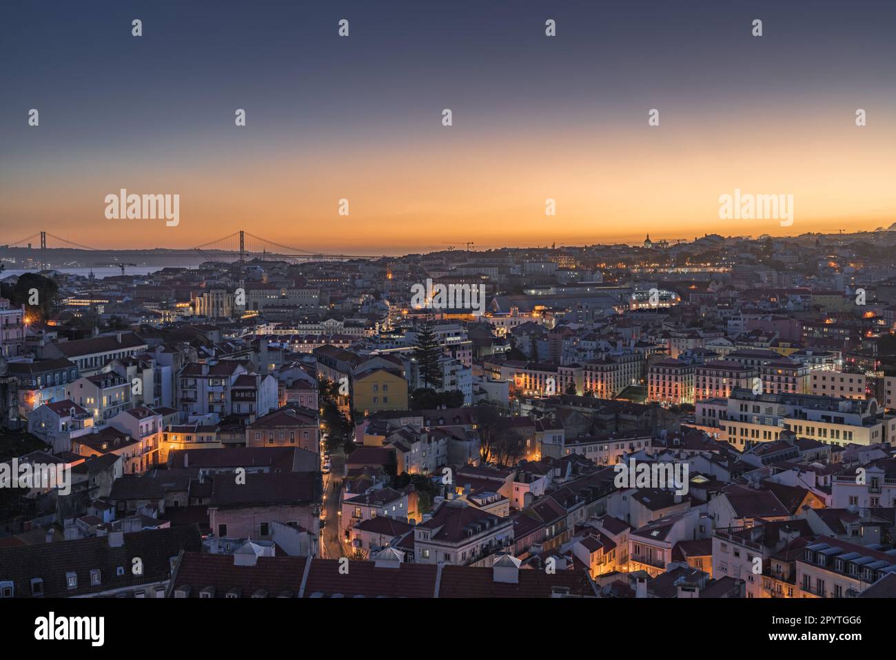 City skyline of the old Alfama district in Lisbon at dusk Stock Photo