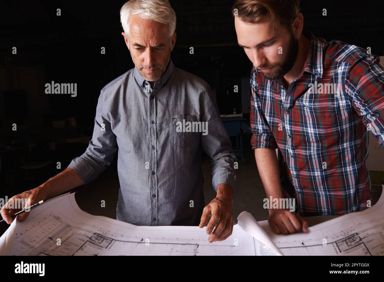 Turning his vision into reality. An architect drawing up plans Stock