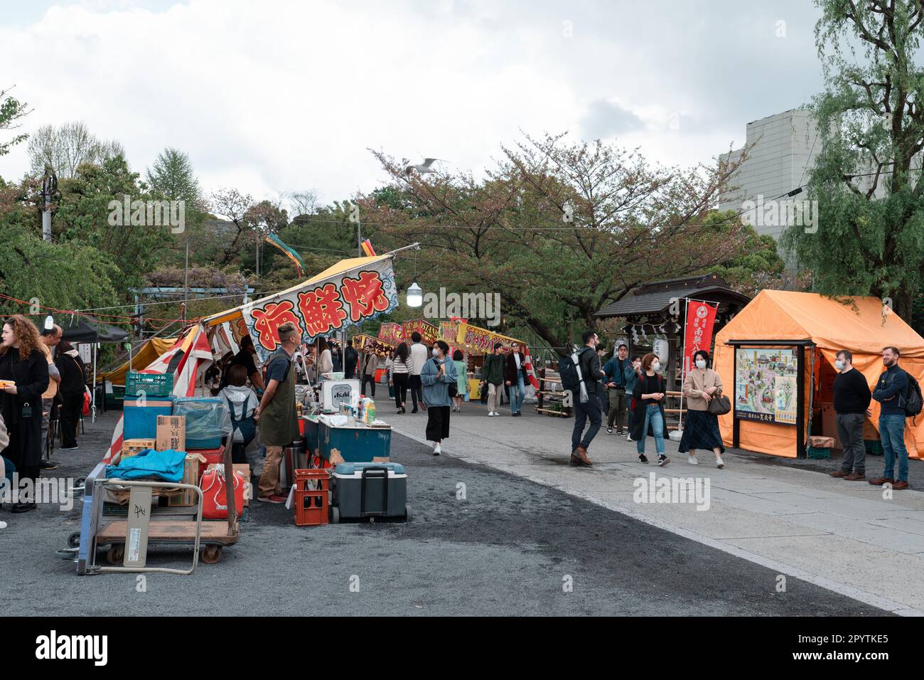 TOKYO, JAPAN - APRIL 8, 2023: Street food venders at Ueno park selling food to people Stock Photo