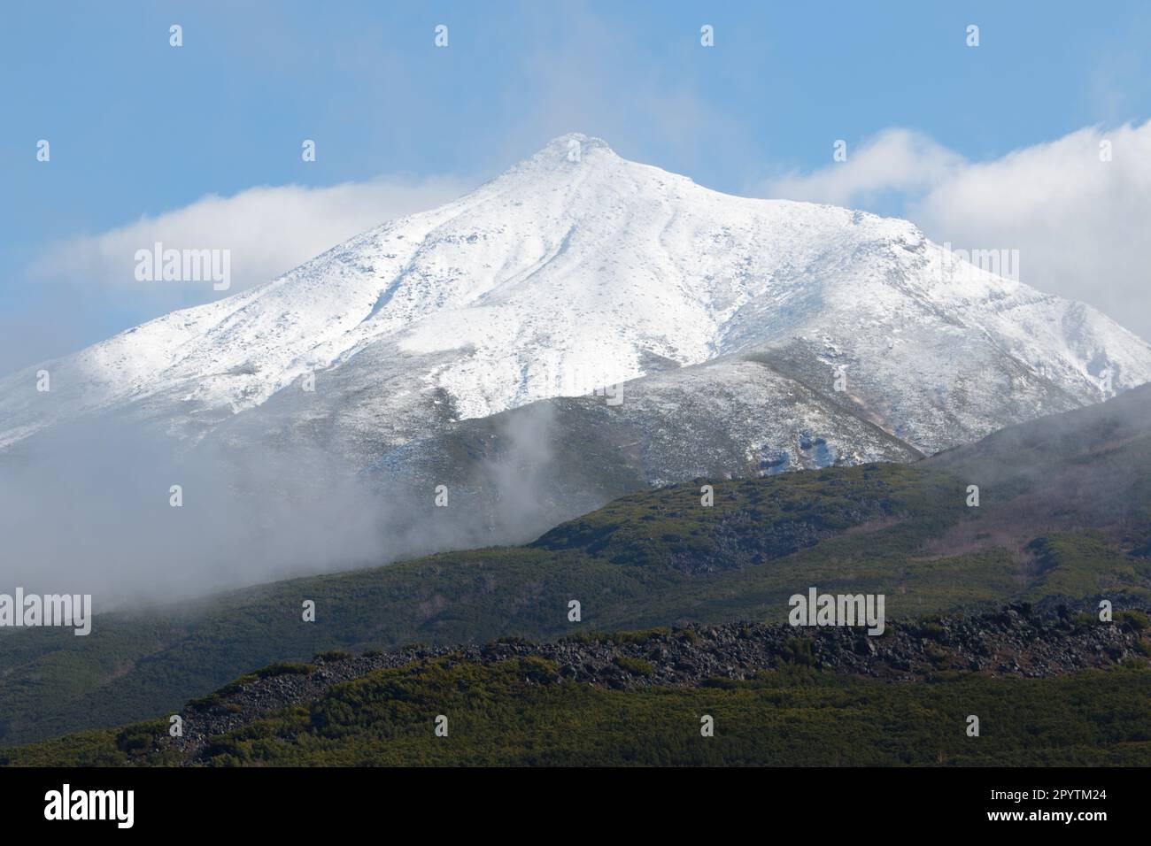 Snow-capped volcano mountain in autumn Stock Photo