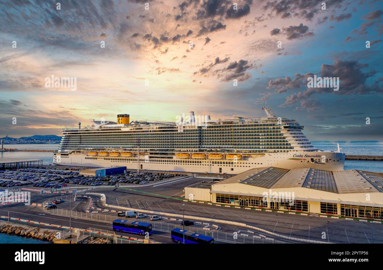 The huge cruise ship, costa smeralda, berthed in the cruise terminal in Marseille, France at sunset Stock Photo