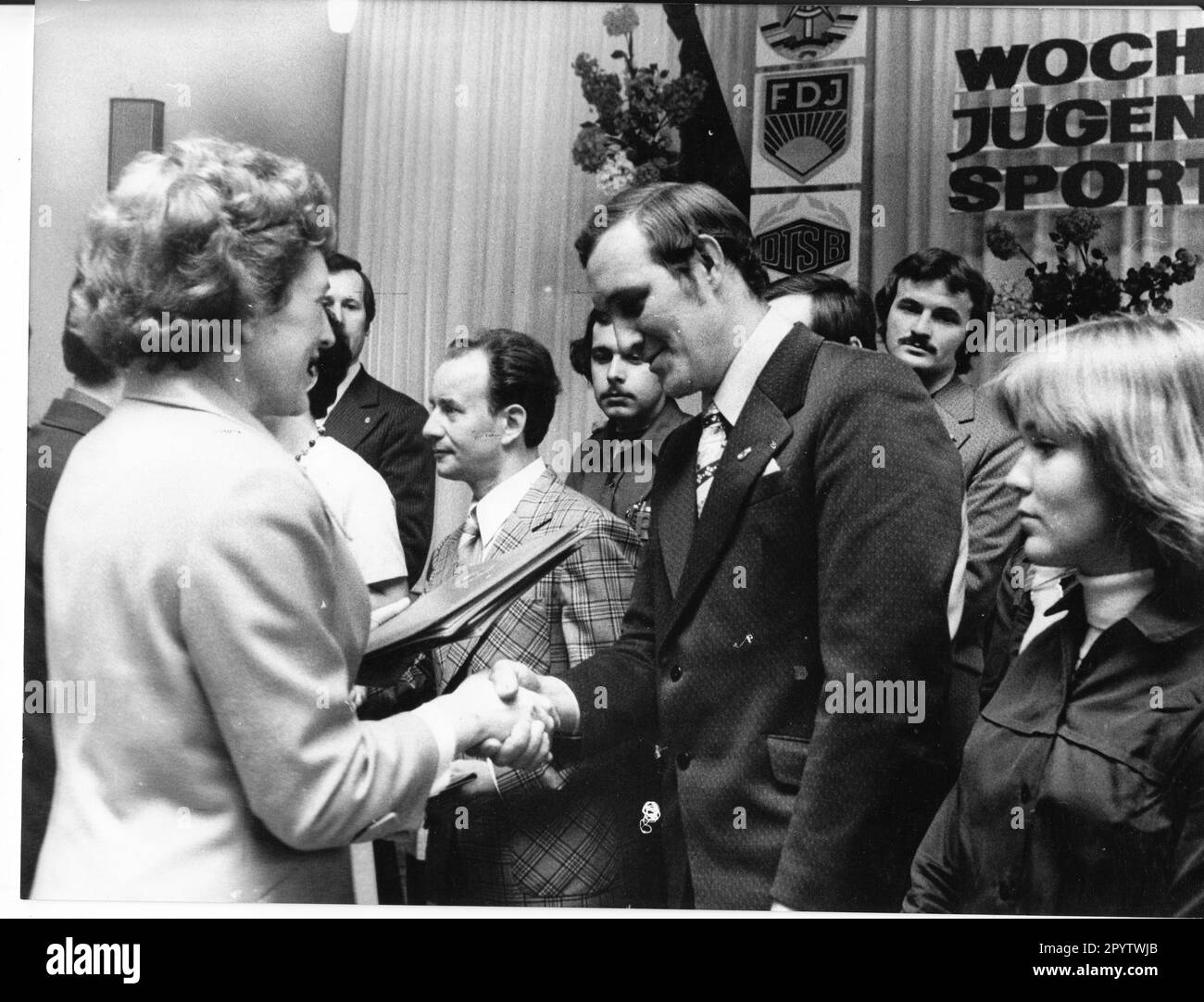 'Opening of the ''Week of Youth and Sportsmen'' in the Culture and Sports Hall in the city of Brandenburg. Central opening event of the GDR with about 2000 delegates. Opening by Paul Verner, member of the Politburo and Secretary of the Central Committee of the SED, Egon Krenz, 1st Secretary of the FDJ. Günther Jahn, 1st Secretary of the Potsdam district leadership of the SED. Awarding of sports officials on stage. Ceremonial event. Event. GDR. historical. Photo: MAZ/Bruno Wernitz,29.05.1976 [automated translation]' Stock Photo