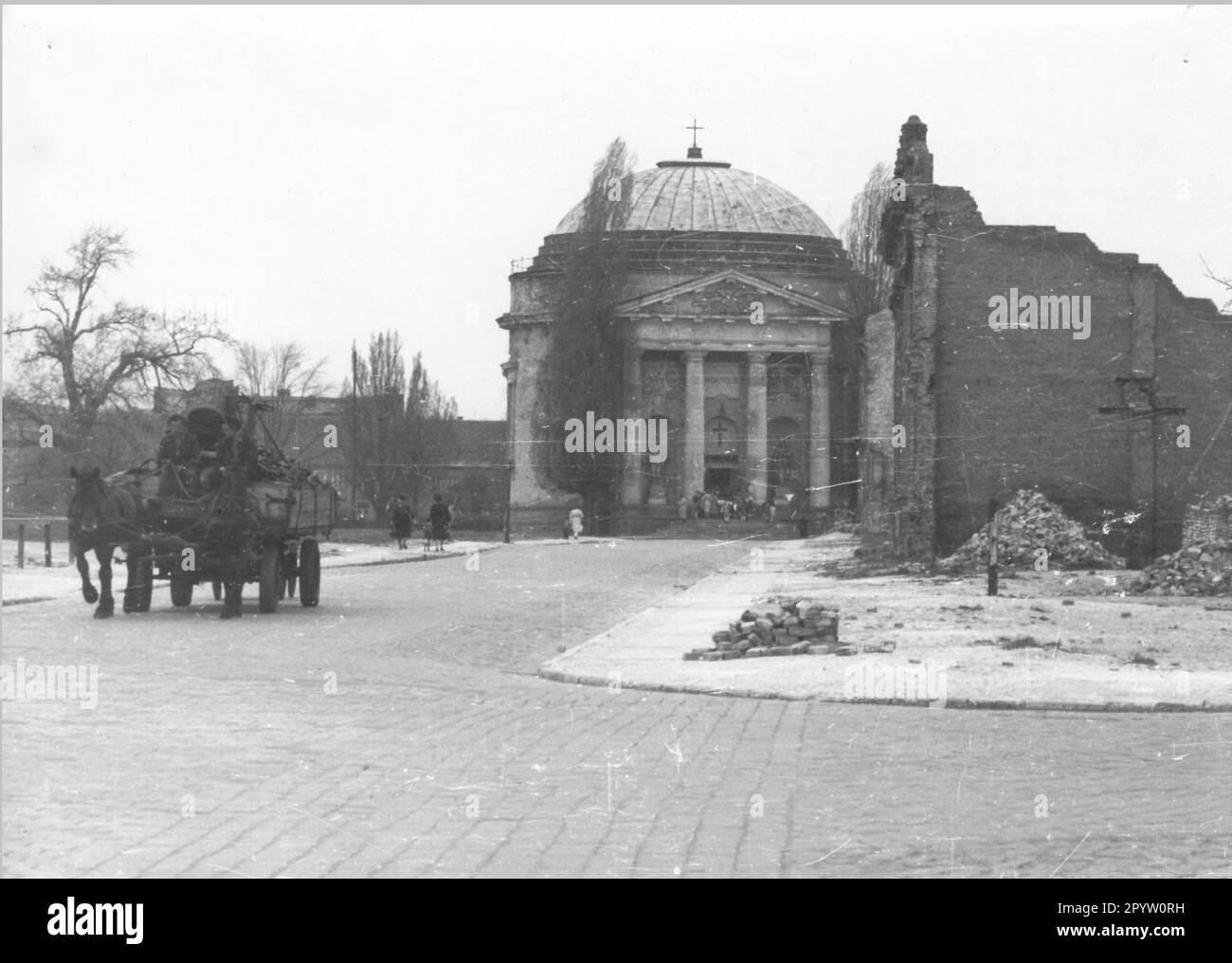 French street with French church after the war. Horsedrawn carriage