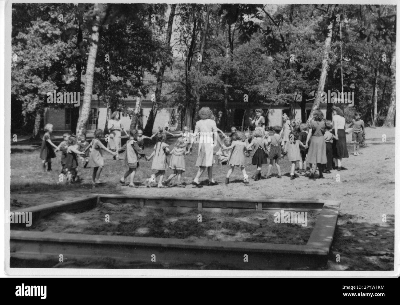 Potsdam kindergarten in Bornstedt 1950 children round dance sandbox