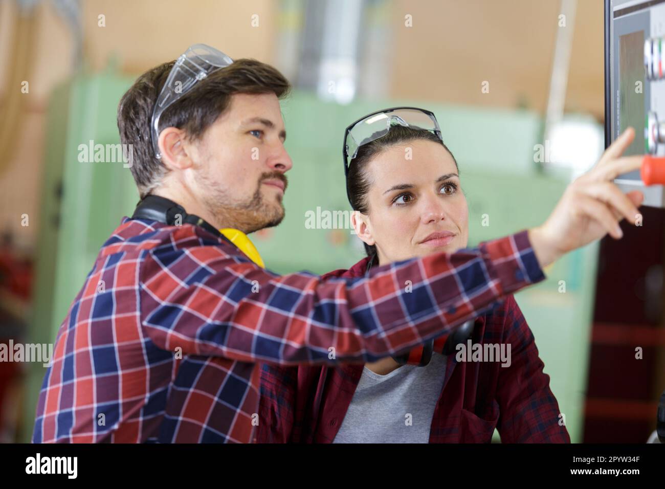 man and woman with machine cnc Stock Photo - Alamy