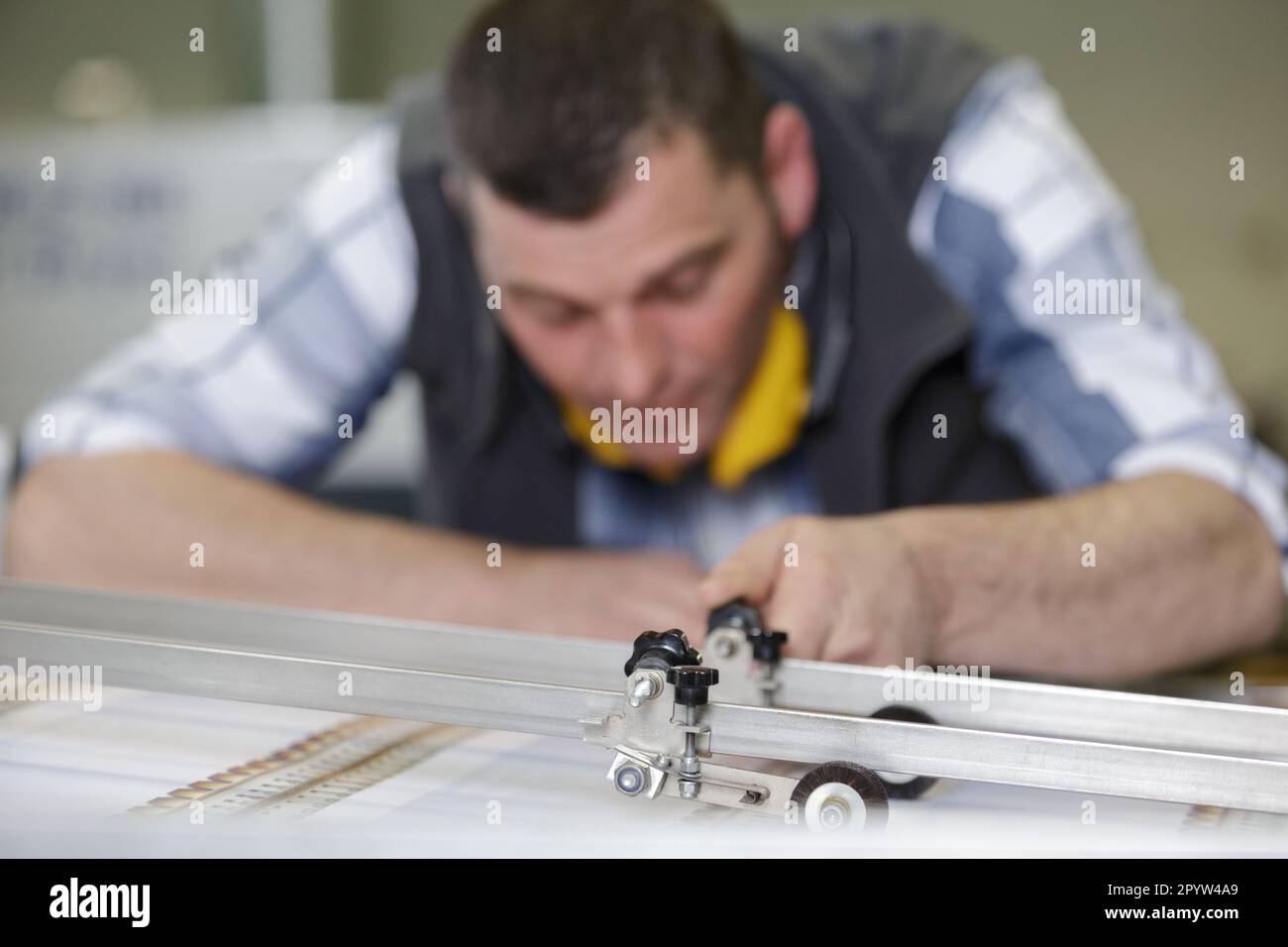 worker leaning on the floor at construction site Stock Photo