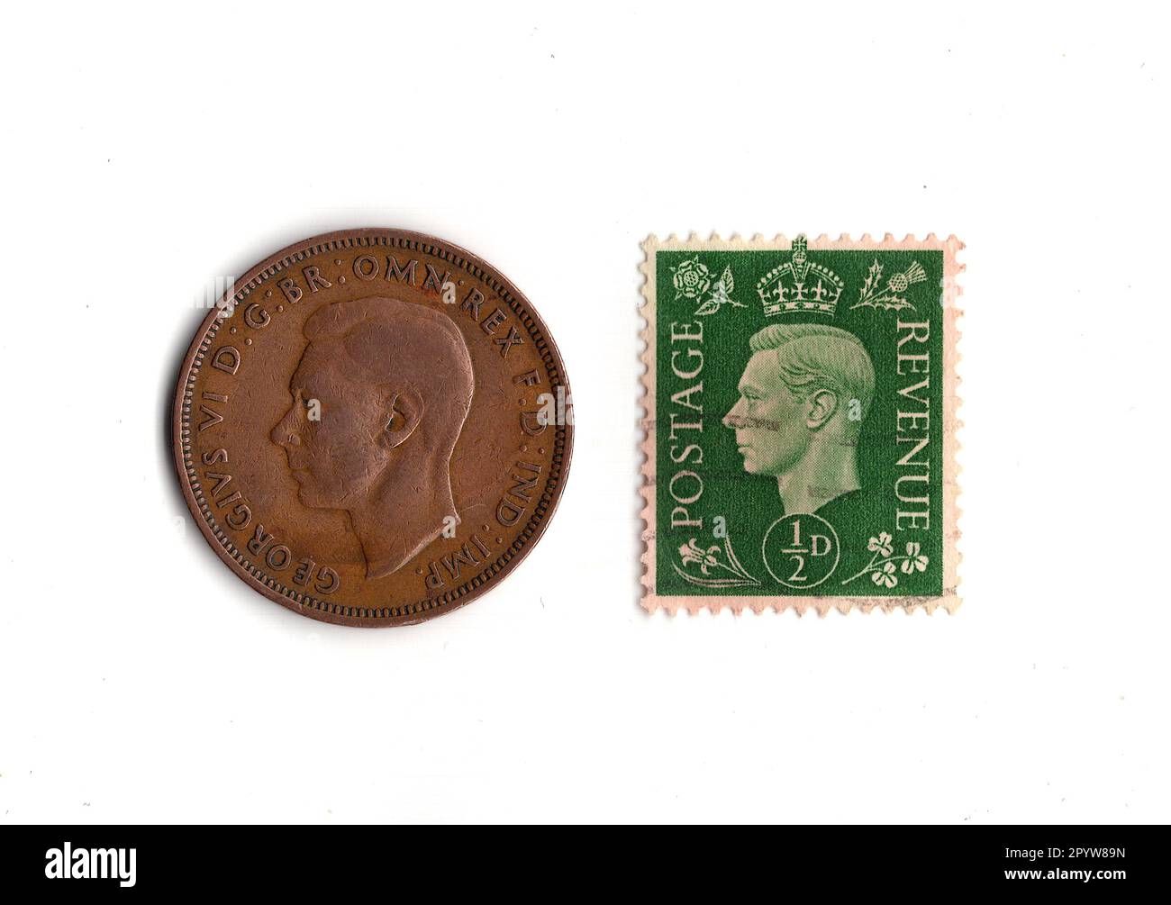 half-penny-coin-and-stamp-from-the-reign-of-king-george-vi-isolated-on