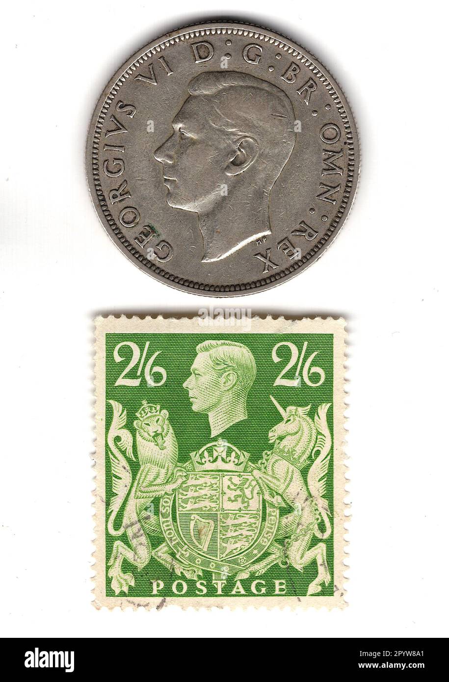 Half crown and stamp from the reign of King George VI isolated on a white background. Stock Photo