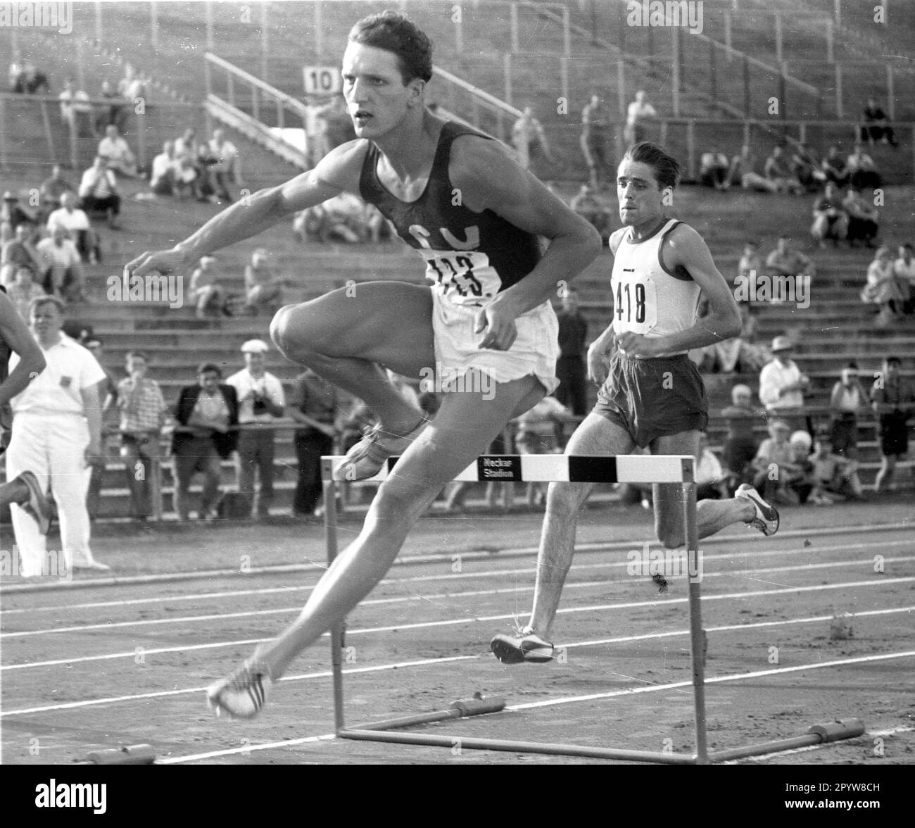 Athletics, DM in Stuttgart 24.07.1959 , Martin Lauer (ASV Cologne) in action over the hurdle [automated translation] Stock Photo