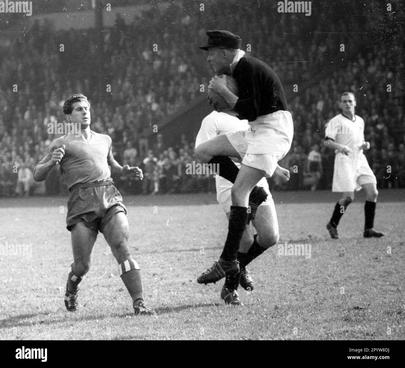 FC Schalke 04 - Borussia Mönchengladbach 4:0 /23.09.1956/ Goalkeeper Bodo Hallwas (Borussia) catches the ball , left Otto Laszig (S04) Editorial use only ! for journalistic purposes only ! [automated translation] Stock Photo