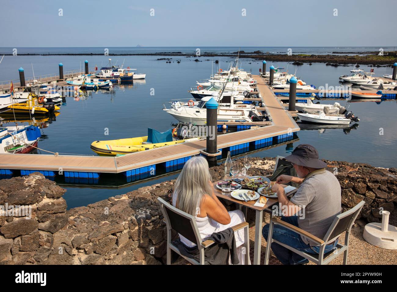 Spain, Canary Islands, Lanzarote island, Orzola. Marina. Outdoor restaurant. Stock Photo