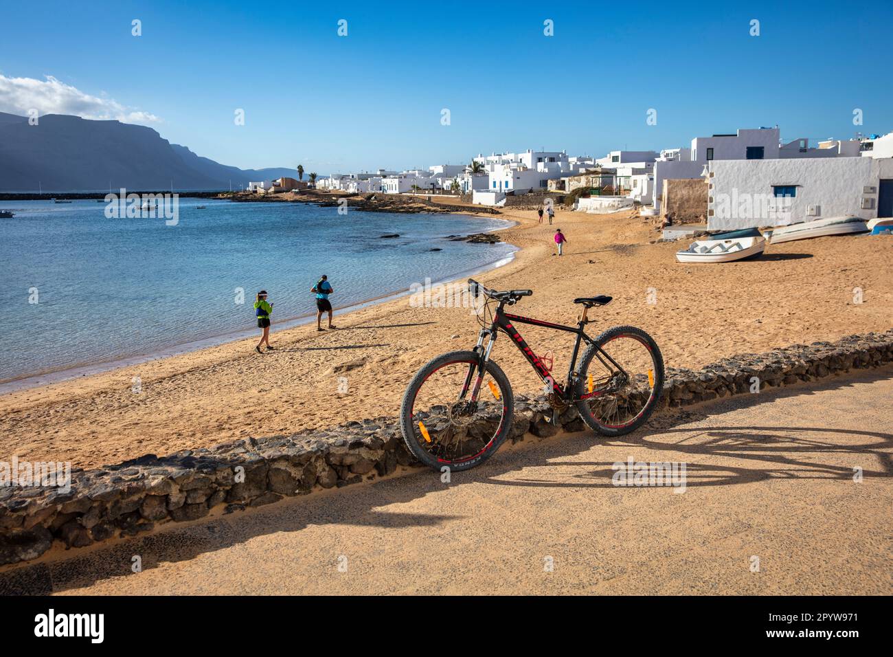 Spain, Canary Islands, Lanzarote island, La Graciosa Island. Caleta de Sebo. Port. Bicycle. Stock Photo