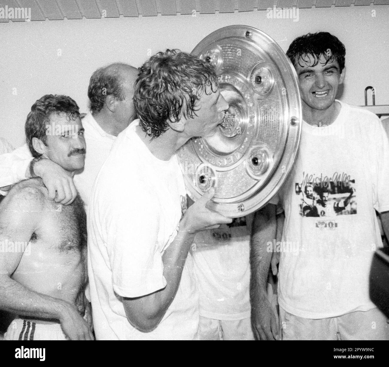 VFB Stuttgart German Champion 1992 16.05.1992 / Guido Buchwald kisses the championship trophy , left Fritz Walter, right Slobodan Dubajic [automated translation] Stock Photo