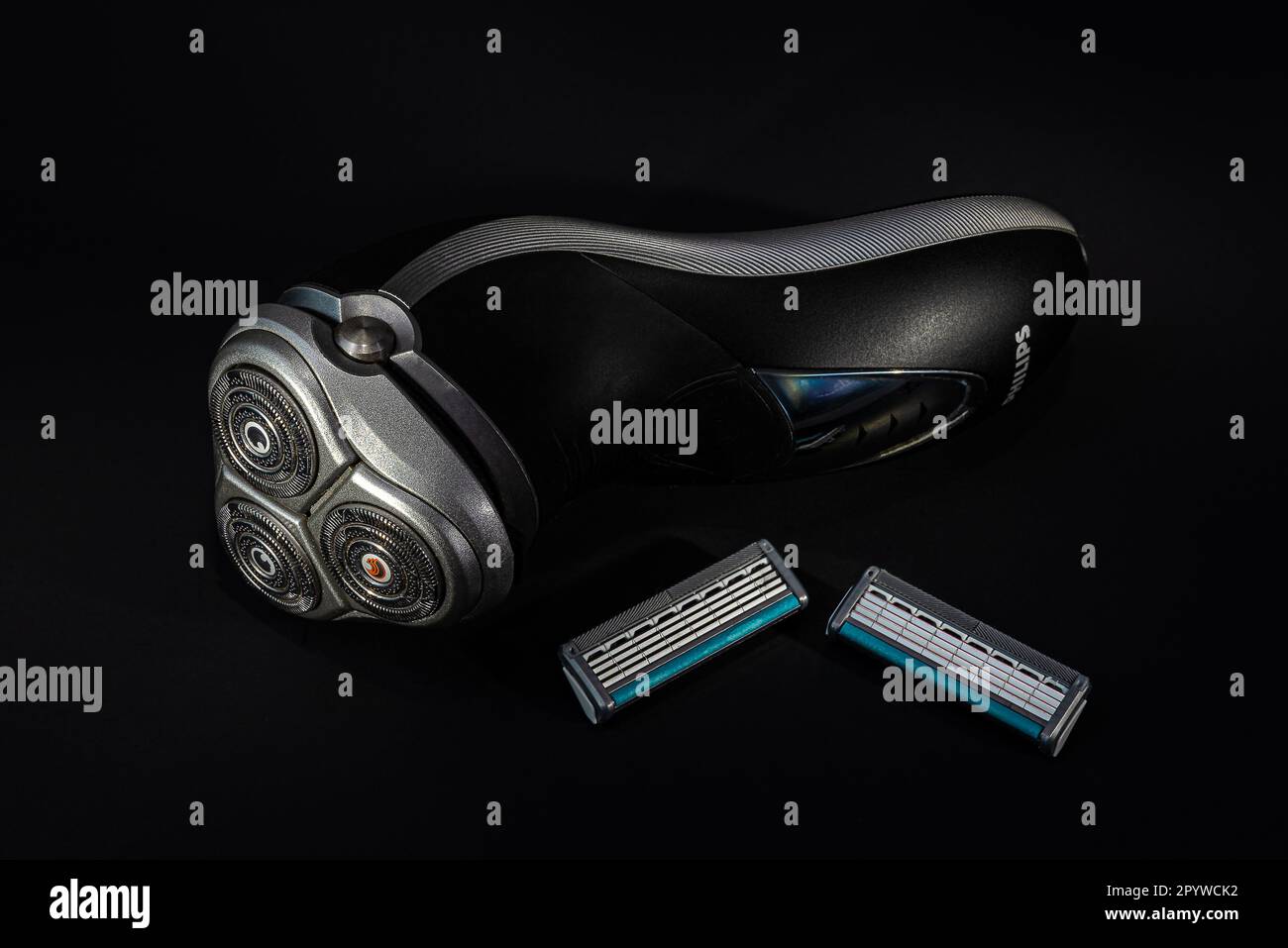 Electric beard shaver. And a set of old razors.Clean shave. Now the