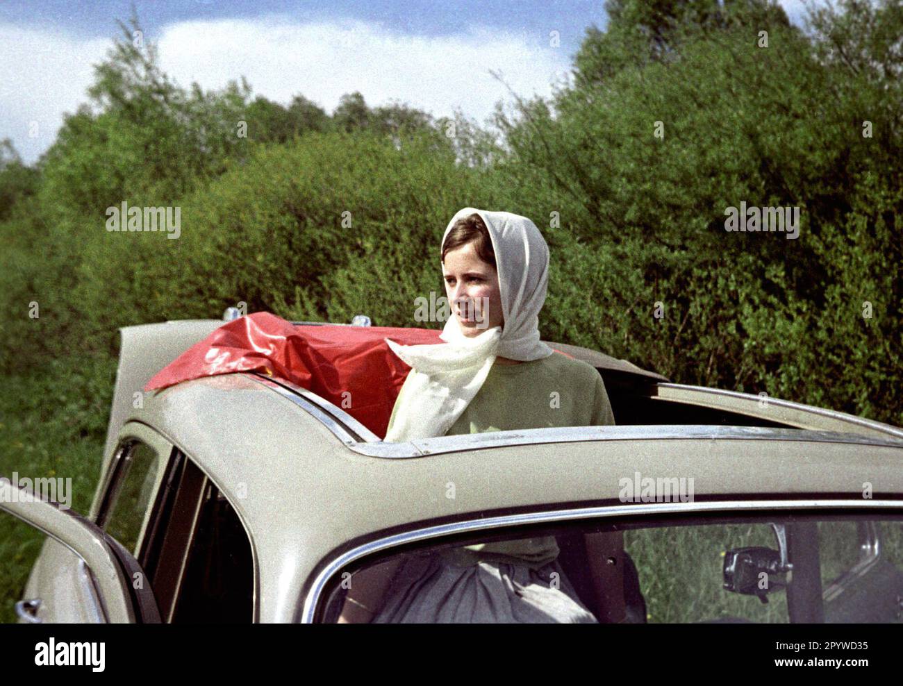 Young woman with a headscarf in the style of the sixties. [automated translation] Stock Photo