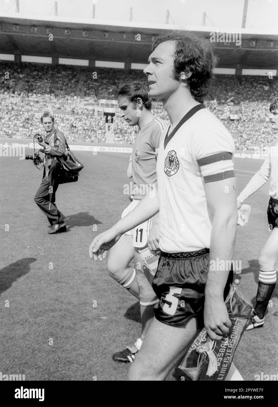 Soccer World Cup 1974 / Final round Group B / FRG - Yugoslavia 2:0 / 26.06.1974 in Duesseldorf / The two team captains: Franz Beckenbauer (Deut./front) and Dragan Dzajic (Yugoslavia) come onto the pitch. [automated translation] Stock Photo