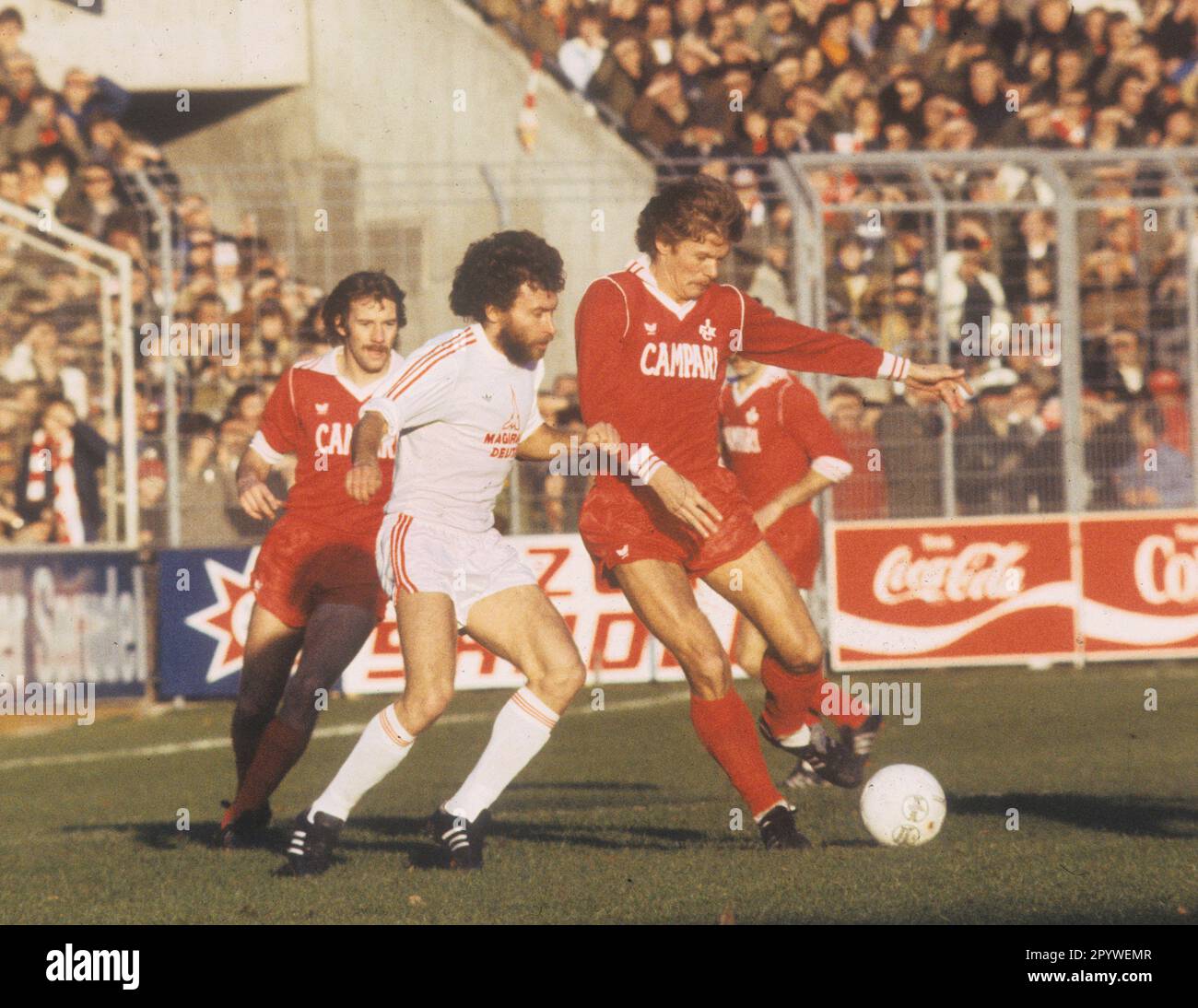 1st FC Kaiserslautern - FC Bayern Munich 2:1 / 18.11.1978. Reiner Geye (FCK) action on the ball in front of Paul Breitner (FCB). In the background Jürgen Groh (FCK). For journalistic use only! Only for editorial use! [automated translation] Stock Photo