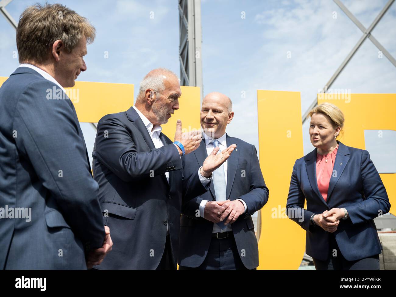 05 May 2023, Berlin: Richard Lutz (l-r), Member of the Board of Deutsche Bahn AG, Reinhard Müller, Member of the Board of EUREF AG, Kai Wegner (CDU), Governing Mayor of Berlin, and Franziska Giffey (SPD), Berlin Senator for Economic Affairs, Energy and Operations, visit the construction site. The EUREF Campus Berlin celebrates topping-out ceremony in the Schöneberg gasometer on the occasion of the renovation in accordance with the preservation order. EUREF AG is a privately owned developer of energy and environmentally optimized real estate. Photo: Hannes P. Albert/dpa Stock Photo