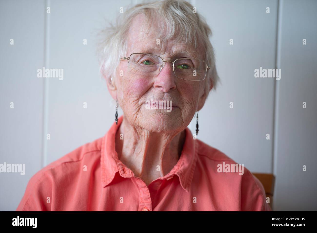 Mature woman in orange shirt hi-res stock photography and images - Alamy