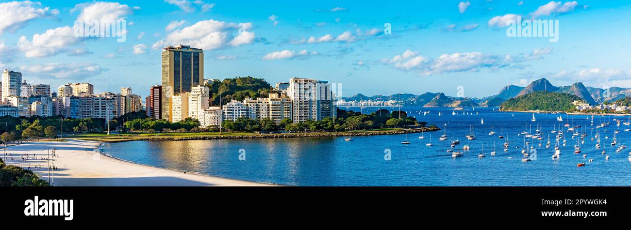 View of Botafogo district coastline with Guanabara bay waters full of  sailboats and vessels anchored nearby the Yatch Club under summer sunny day  Stock Photo - Alamy