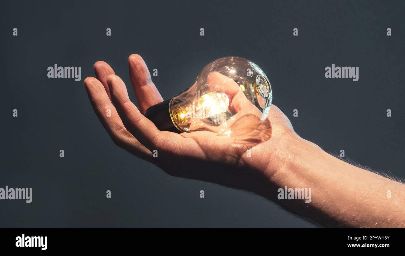 Lightbulb holding hi-res stock photography and images - Alamy