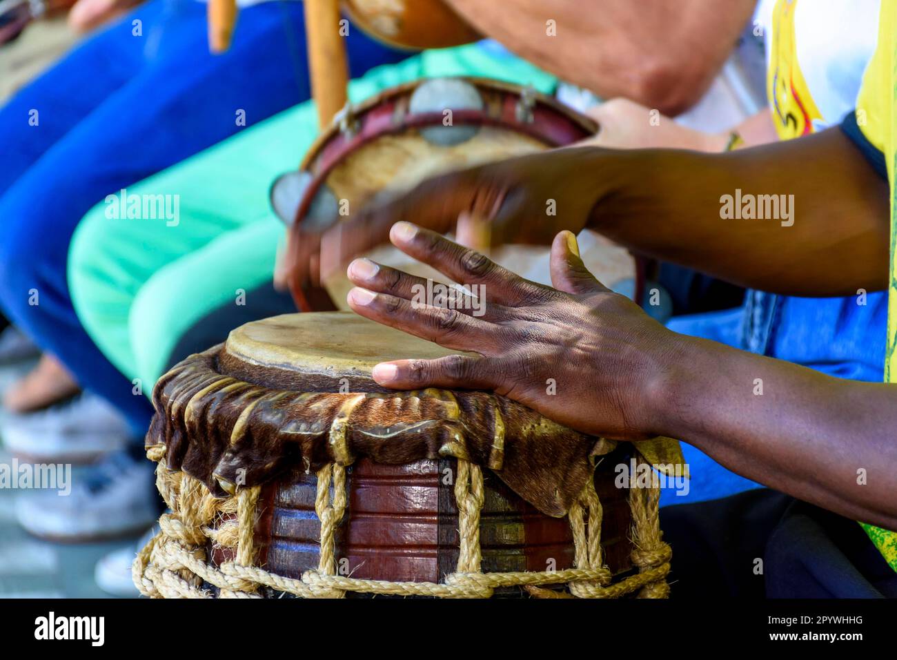 Percussion instrument called atabaque being played in traditional afro