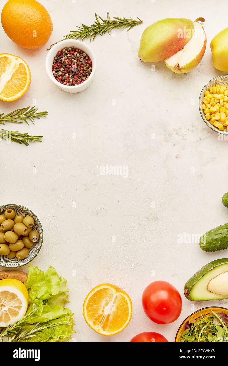 Low carb, FODMAP, Mediterranean, KETO plant based diet food. Fruits, vegetables, greens, citrus, olives with copy space in the centre. Detox, healthy Stock Photo