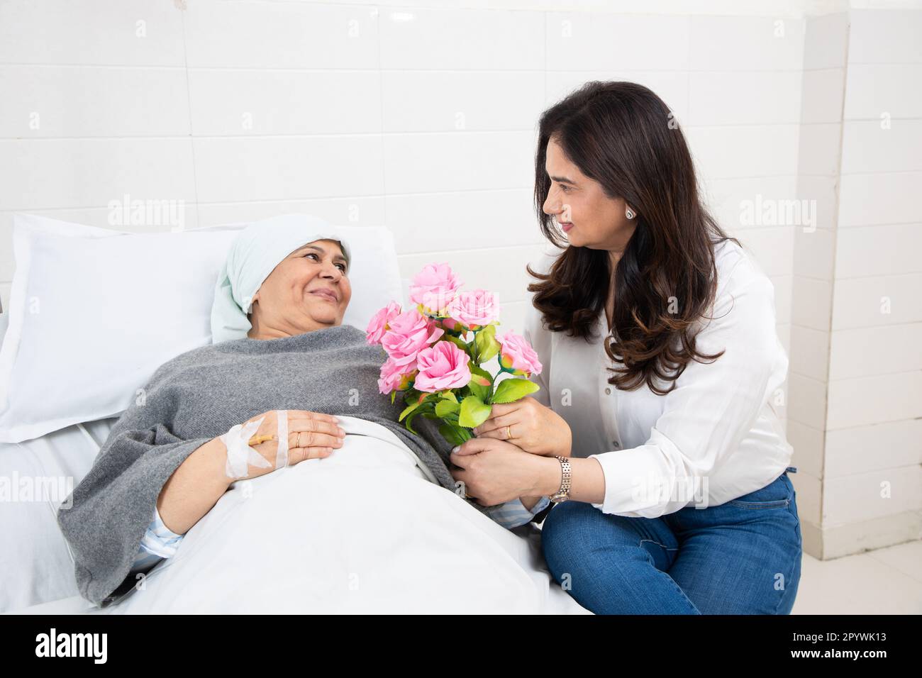 Indian daughter visit her elderly mother cancer patient undergoing