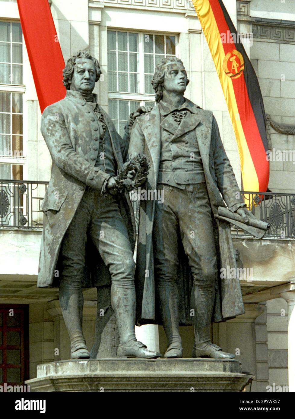 Thuringia / GDR / 1988 Weimar, city German Classic. Monument Wolfgang Goethe and Friedrich Schiller in front of the National Theater. Behind red flag and GDR national flag // Bundeslaender *** Local Caption *** History / Fascism / Germany / Concentrationcamp Buchenwald near Weimar in Communist Germany.  The political strategy of the SPD Party: approach in small steps. The visit of 400 SPD members from West-Berlin was highly political in those days. [automated translation] Stock Photo