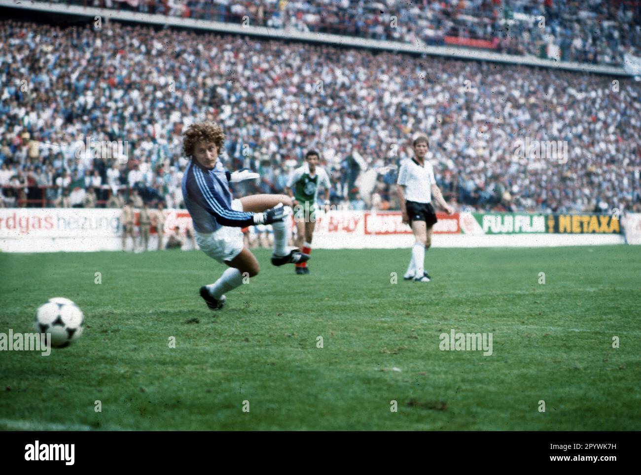 'Football World Cup 1982 in Spain. Preliminary round: Algeria - Germany 2:1 / 16.06.1982 in Gijon. / Goalkeeper Harald ''Toni'' Schumacher beaten for the second time. Here at the 2:1 for Algeria by Belloumi (not on the picture). At the back Karlheinz Förster (FRG). [automated translation]' Stock Photo