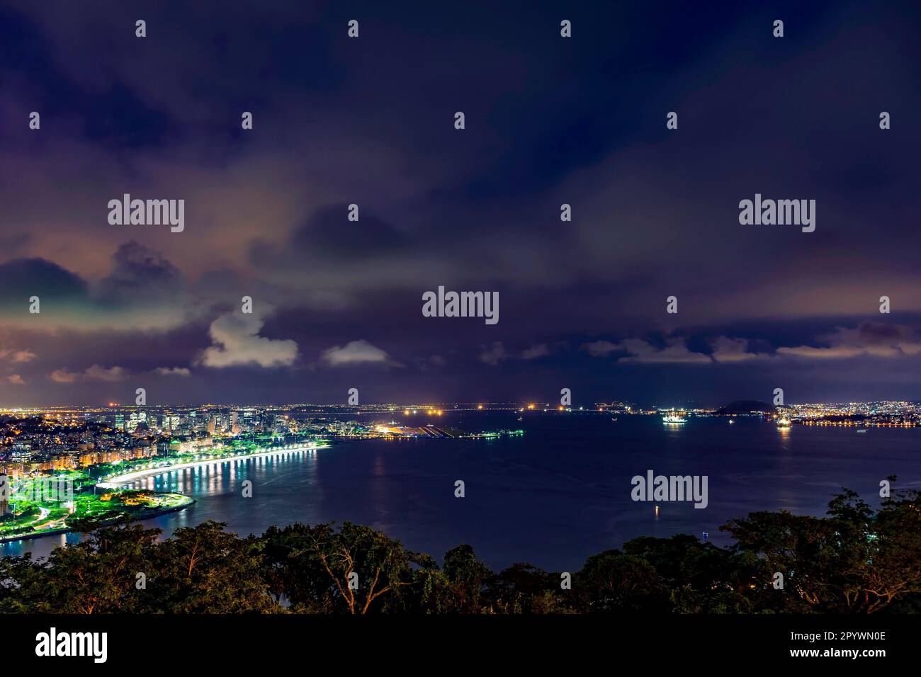 Night view of Rio de Janeiro downtown, Guanabara bay, Santos Dumont airport, Flamengo beach and the streets and buildings of city illuminateds, Brasil Stock Photo