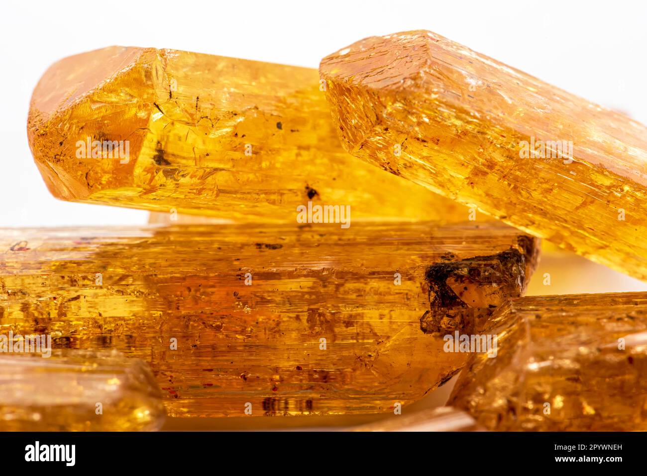 Studio photography of Brazilian imperial topaz in raw state with white