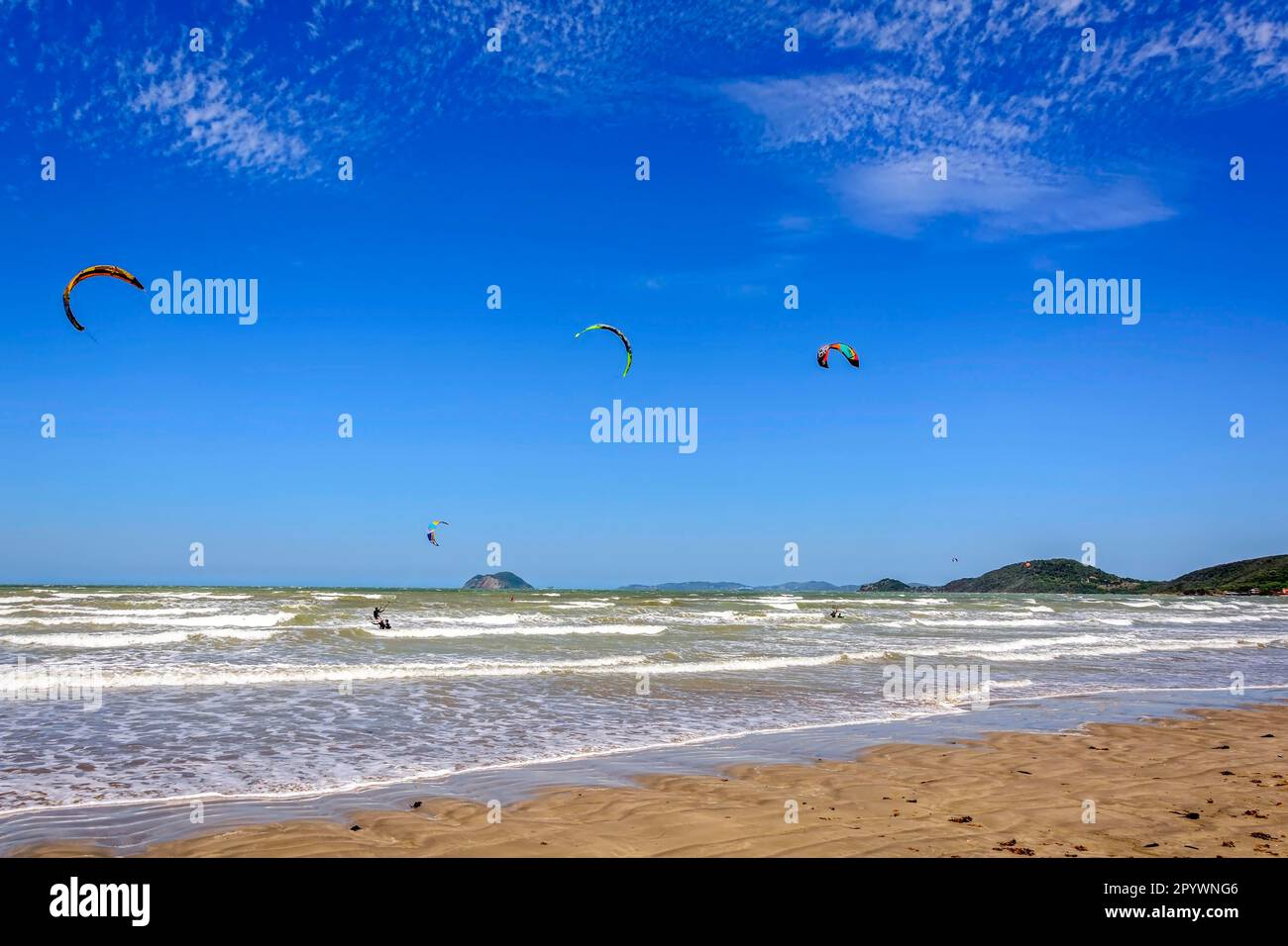 Kitesurfers enjoying the wind and waves of Rasa beach in Buzios in the state of Rio de Janeiro, Praia Rasa, Buzios, Rio de Janeiro, Brasil Stock Photo