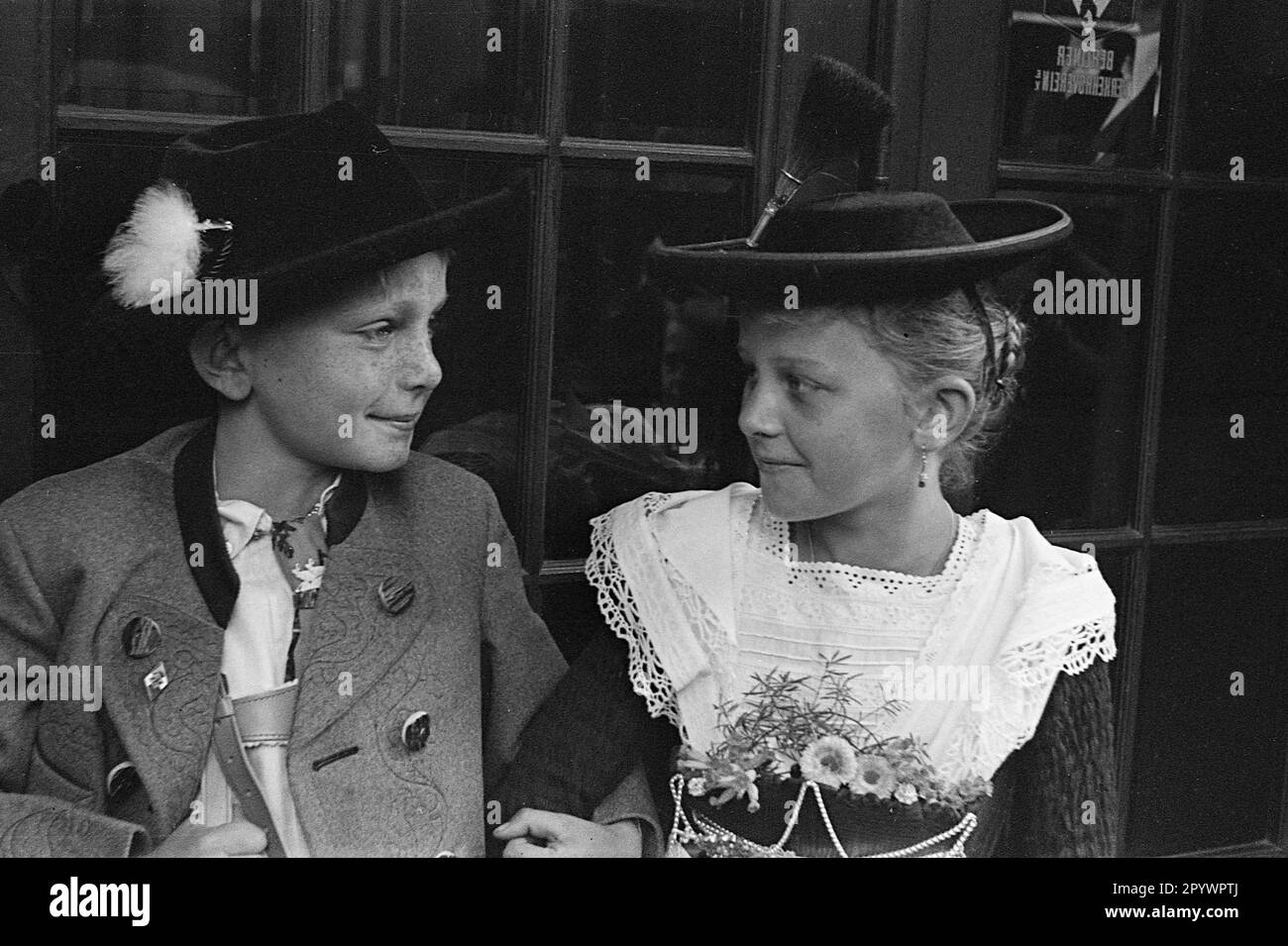 A boy and a girl in traditional clothes. Presumably in Berlin, 1935. Stock Photo
