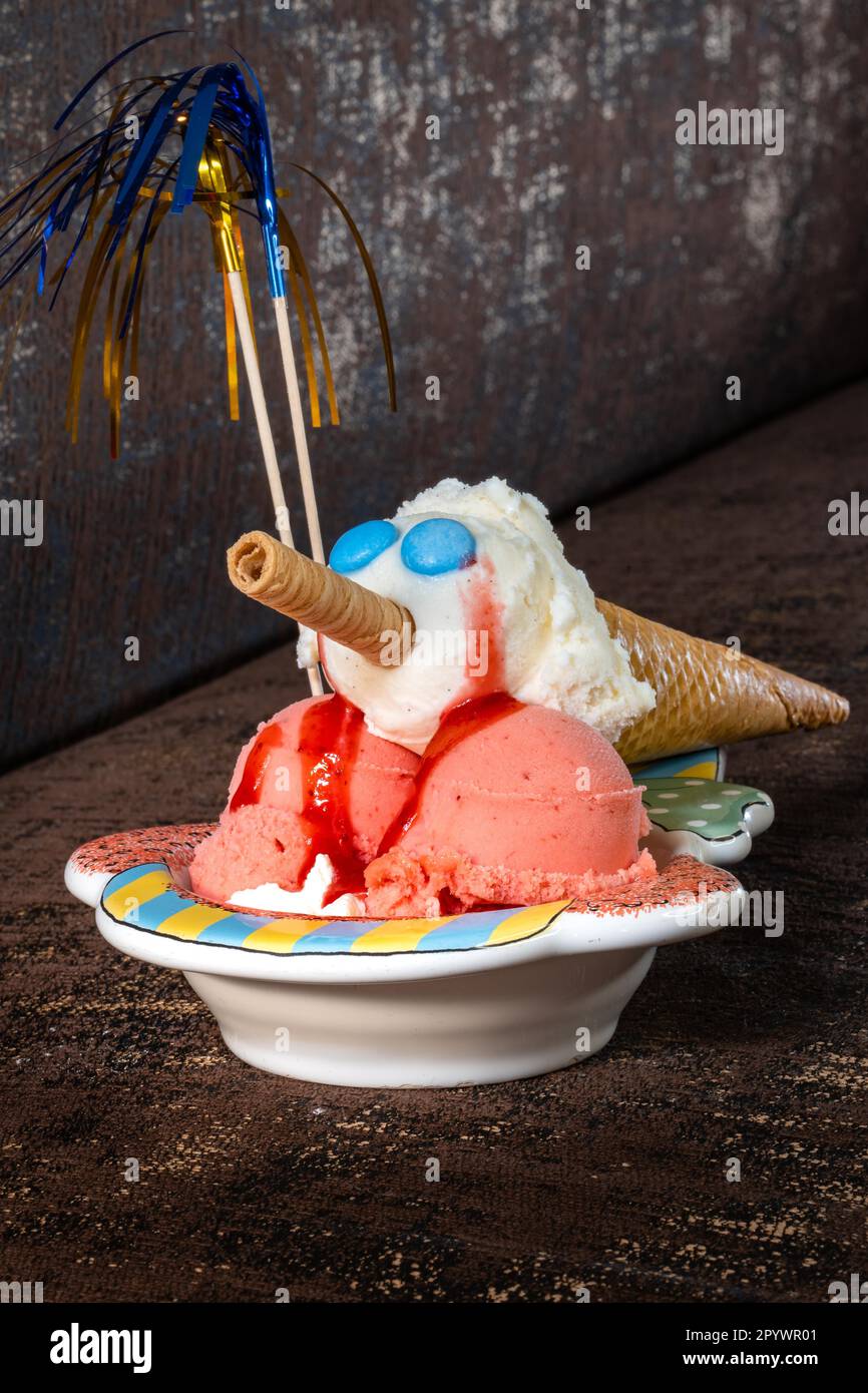 Children's ice cream sundae on brown background Stock Photo Alamy