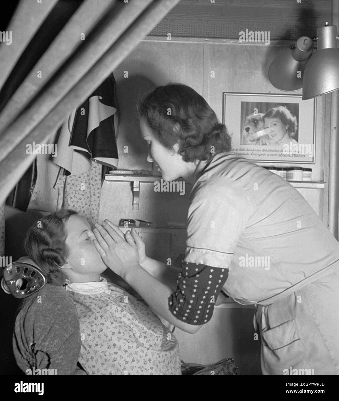 Beautician massaging the face of her patient Stock Photo Alamy