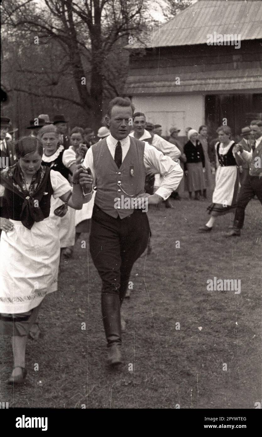 Young men and women dancing at a traditional costumes festival in ...