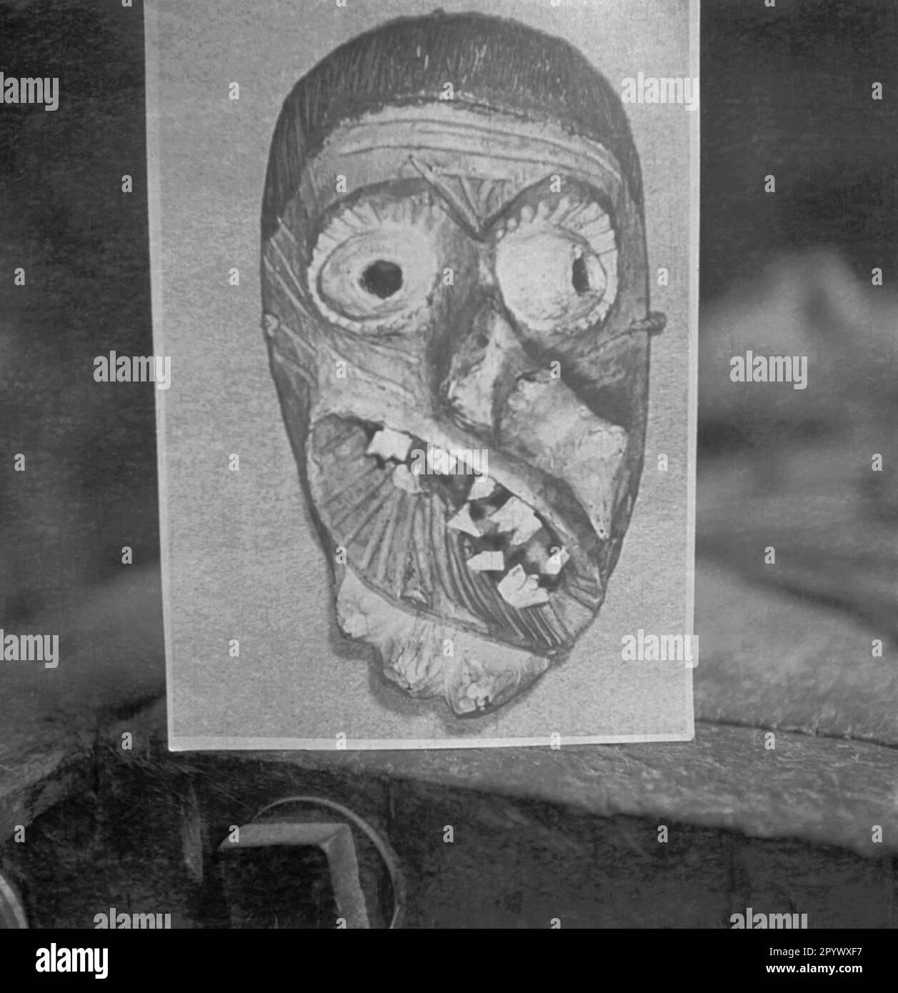 Drawing of a grotesque wooden mask (undated picture). Stock Photo