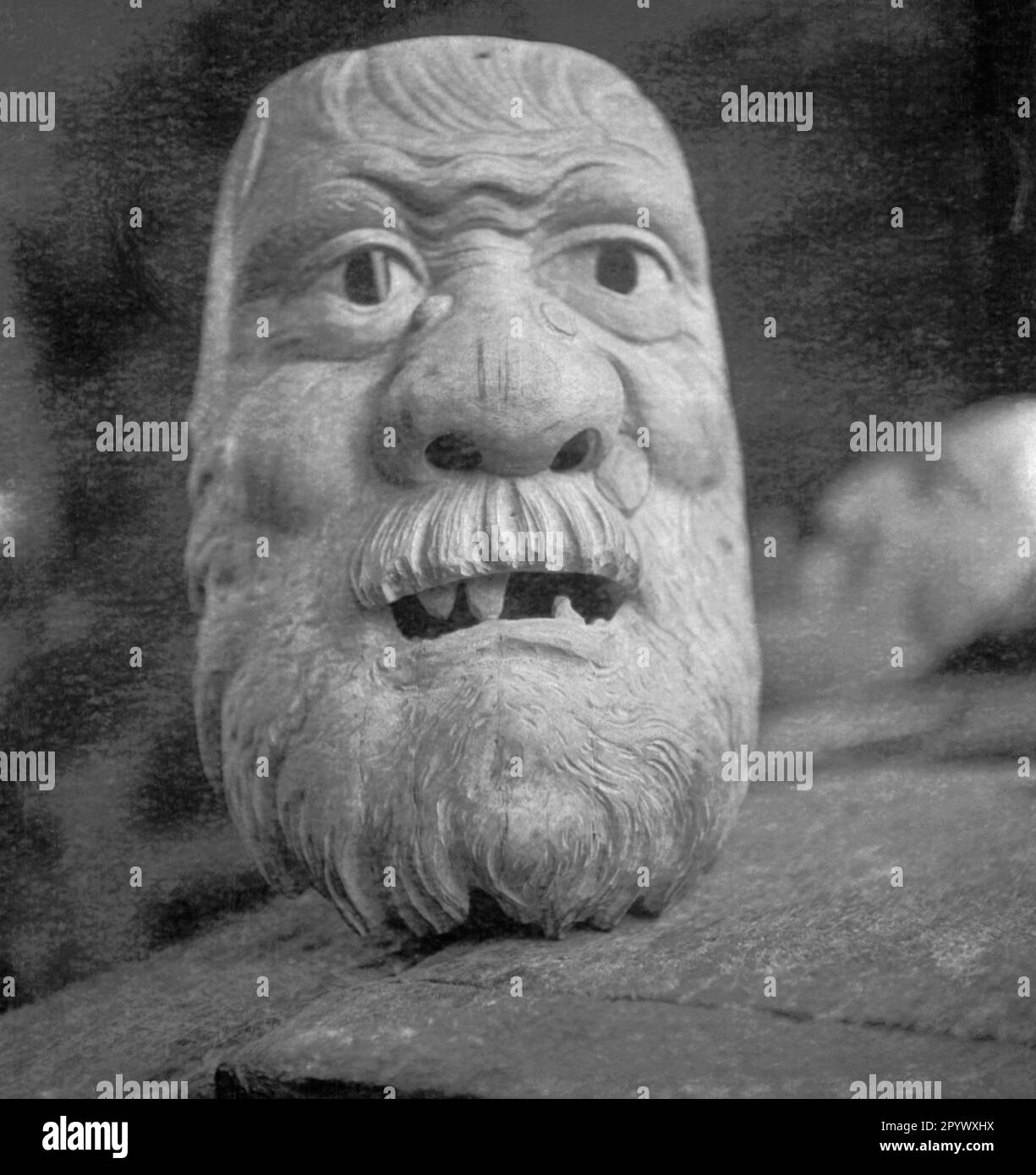 Hand carved wooden mask in a in Bavaria (undated picture Stock